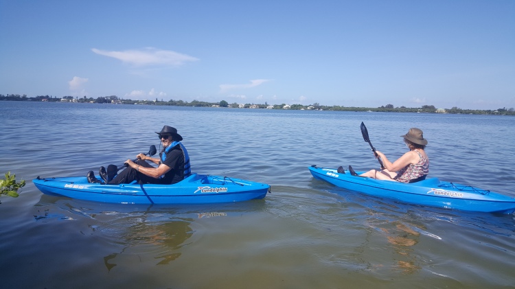 Narda and Terrell kayaking across Lemon Bay and on to Australia