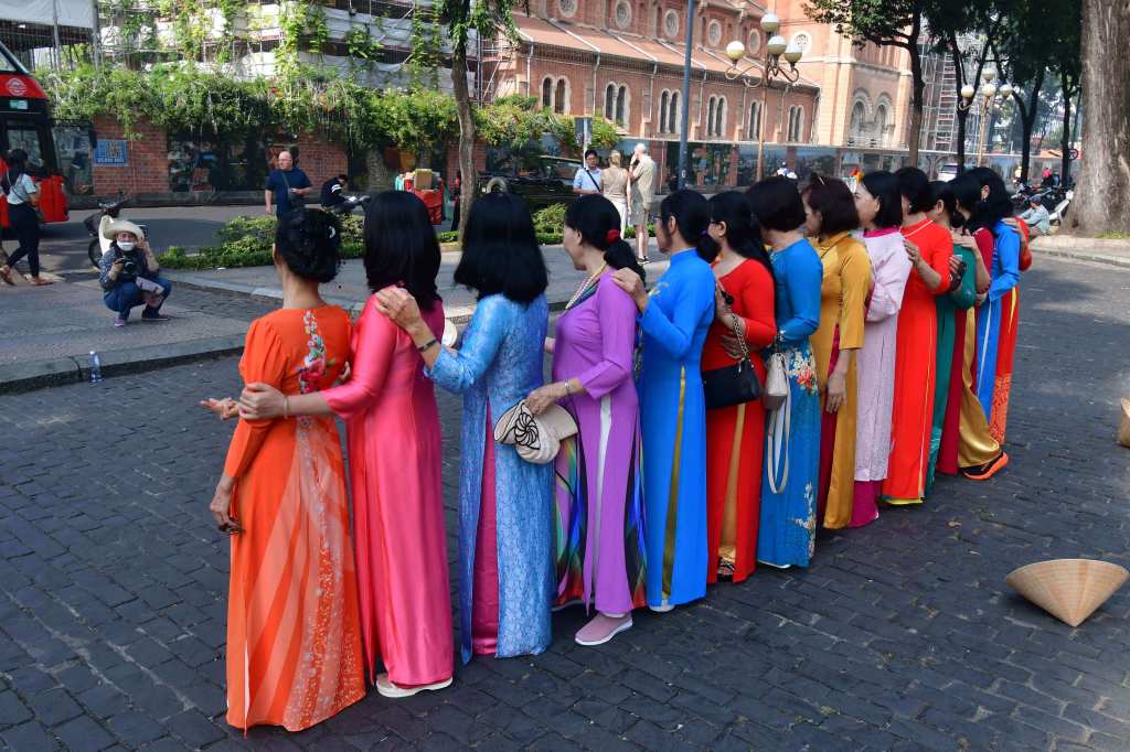 Ao Dai, the traditional Vietnamese long dress, is very popular during Tet. These gowns, in the graceful traditional style or more colorful and innovative styles, enhance the charm of Vietnamese women
