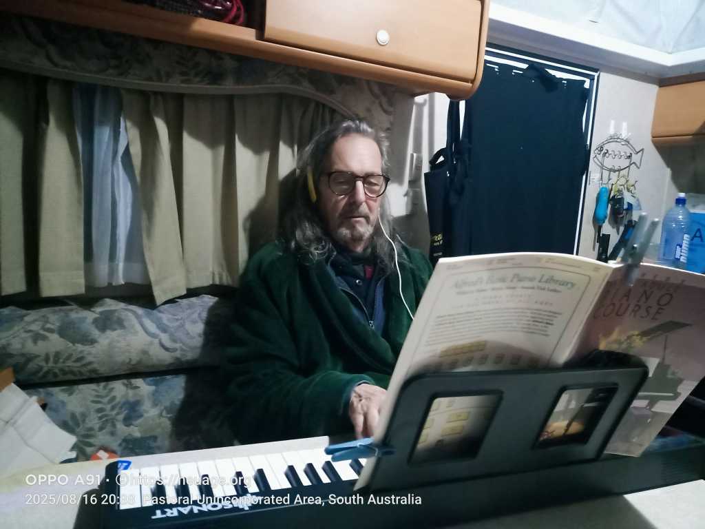 Terrell tickles the ivory (plastic) somewhere in the outback